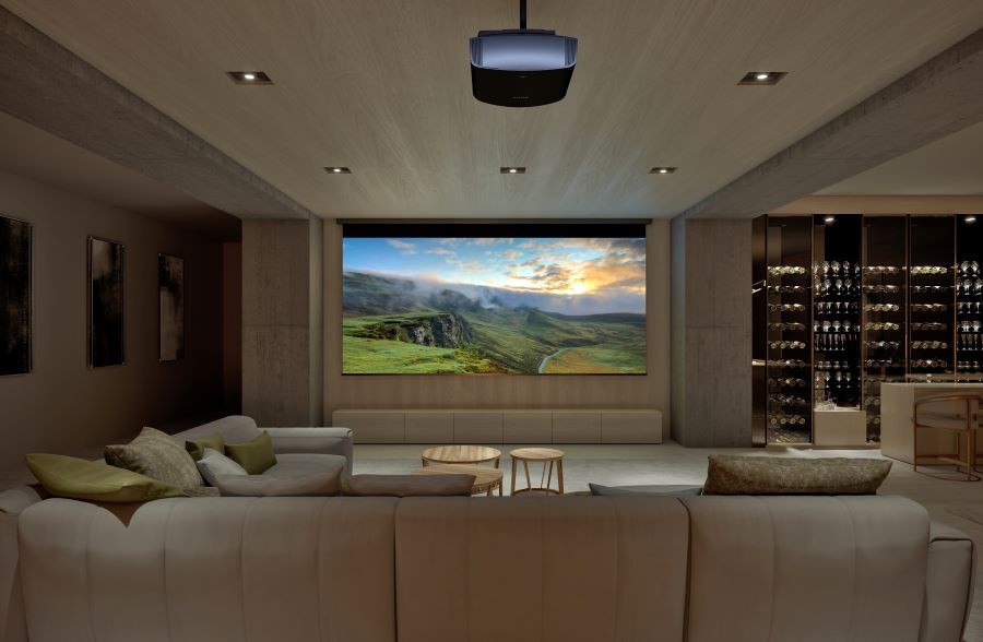 Multi-use media room with a projector, movie screen, and sectional. 
