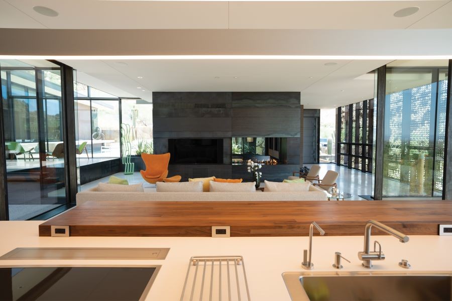 A modern home with an open floor plan and in-ceiling speakers.